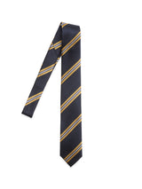 The BGponsy Tie - Dark Navy by Blue de Gênes pairs dark navy silk with gold and silver diagonal stripes, offering timeless elegance for classic accessory enthusiasts. Displayed on white, it’s a refined choice like the khaki striped tie.