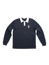 The BGclubhouse Rugby Sweatshirt - Navy by Blue de Gênes is a long-sleeve rugby sweatshirt made from soft cotton jersey, featuring a classic white collar and a small embroidered crest in green, white, and red on the left chest—a nod to athletic heritage.