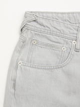 Close-up of the front pocket area of BGgiacomo Color Jeans - Dolphin Grey by Blue de Gênes, showing stitching, a coin pocket, metal rivets, part of the waistband, and belt loop in light gray rigid denim.