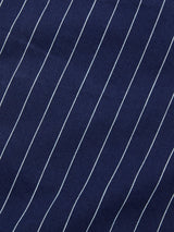 Close-up of BGcupra Toll Shorts - Navy Stripe by Blue de Gênes, featuring dark blue fabric with thin white diagonal pinstripes, showcasing classic texture ideal for versatile summer workwear.