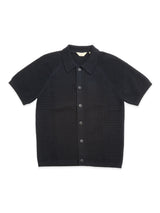 Introducing the BGbilly S/S Cardigan in Dark Navy by Blue de Gênes: this vintage-inspired, short-sleeve button-up knit shirt features a textured pattern, classic collar, and seven front buttons. Crafted from 100% cotton, it offers ultimate comfort and timeless style.