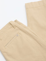 Close-up of Blue de Gênes BGpalco Rodas Pants in Pale Khaki, featuring a relaxed fit, smooth neatly finished fabric, visible waistband, belt loops, and a back pocket with a stitched tag.