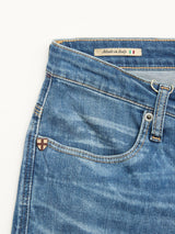 Close-up of Blue de Gênes BGrepi Misto Jeans - Med Used, featuring the front pocket, belt loop, and small metal emblem for classic style. Inside waistband label says Made in Italy with an Italian flag.