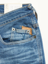 A close-up of Blue de Gênes BGrepi Misto Jeans - Med Used shows the front pocket, smaller coin pocket with brown patch, visible stitching, belt loop, and a white test label peeking from the waistband.