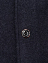 Close-up of the Kojima Wool Jacket - Navy by Blue de Gênes, featuring detailed stitching, a single black button with metallic rim, and a rich wool texture reminiscent of a boiled wool overshirt.
