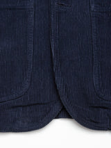 Close-up of the lower front of the Masami Cord Blazer in navy by Blue de Gênes, highlighting its two front pockets and textured corduroy ridges.