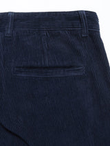 Close-up of the back of Blue de Gênes Etsu Cord Chino in Navy, featuring a garment-dyed waistband with belt loops and a single welt pocket.