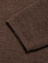 Close-up of the Toyama Knit L/S - Brown by Blue de Gênes, highlighting its textured brown knit fabric and seam detail—showcasing Danish craftsmanship against a matching background.