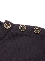 Close-up of the Toyama Knit L/S in Dark Navy by Blue de Gênes—a Merino wool sweater, knitted in Denmark, featuring three black buttons with brown rims sewn along the shoulder seam, shown against a white background.