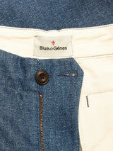Close-up of the Shogun Fano Pant - Denim Blue by Blue de Gênes, showing the inside waistband with branded label, brown button, zipper, and off-white heavy cotton blend lining.