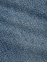 Close-up of BGvinci Girisha Used Jeans by Blue de Gênes shows blue denim fabric with woven texture and diagonal stitching, typical of classic five-pocket jeans.