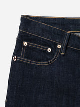 Close-up of the upper section of Blue de Gênes BGvinci Girisha Rinse Jeans in rinse wash, featuring a regular fit, dark blue comfort stretch denim, waistband, front pocket, coin pocket with rivets, and a small shield-shaped logo.