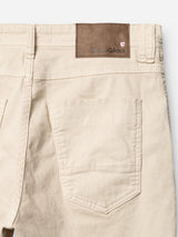 Close-up of the back of BGpaulo Pavia 1 V2 Chino - Ecru by Blue de Gênes, showing a single back pocket and a brown leather patch, inspired by vintage military pants.