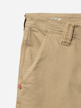 Close-up of the upper section of the Blue de Gênes BGpaulo Pavia 1 V2 Chino in khaki, featuring waistband, belt loop, front pocket, and a red and white tag. Made from soft cotton stretch fabric for comfort.