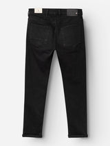 Back view of the Blue de Gênes BGrepi TrueBlack Jeans - Black Denim laid flat, featuring two rear pockets, belt loops, and cuffed hems. Crafted from comfort stretch denim with high-quality craftsmanship throughout, these jeans display both a white and a black label on the waistband.