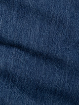 Close-up of blue denim fabric from Blue de Gênes BGmarco Sioux Jeans - Used, highlighting its textured weave pattern and distinctive faded areas characteristic of cotton denim jeans.