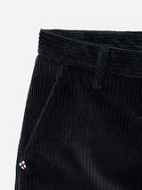 Close-up of Blue de Gênes BGpalco Cord Chino in navy, highlighting the waistband, belt loop, side pocket, and a small round embroidered patch near the pocket.