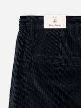 Close-up of the BGpalco Cord Chino in navy—a relaxed fit corduroy trouser with a tapered leg, featuring a back pocket and a Blue de Gênes brand tag tucked into the waistband.