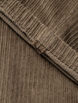 Close-up of the BGpalco Cord Chino in Sepia Tint Brown from Blue de Gênes, highlighting the light brown corduroy fabric with visible vertical ridges and fine stitching details that showcase the distinctive texture and pattern typical of relaxed fit corduroy trousers.