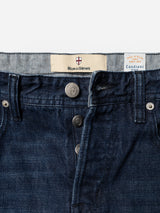Close-up of BGgiacomo Arthour Jeans - Denim Blue by Blue de Gênes, featuring silver buttons, a signature Blue de Gênes waistband label, and a Candiani label reading “Made in Italy since 1938.” The comfort stretch denim showcases visible texture and stitching, emphasizing the durability of these jeans.