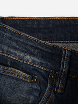 Close-up view of the BGvinci Finlay Jeans - Vintage Wash by Blue de Gênes, featuring a blue regular fit with a waistband, belt loop, and pocket accented by visible orange stitching and metal rivets, crafted from comfort stretch denim for everyday ease.