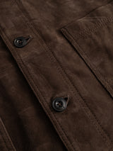 Close-up of the BGvalan Suede Jacket in Dark Brown by Blue de Gênes, showcasing classic blazer-inspired details with two black buttons, visible stitching, and a partial view of the front pocket.