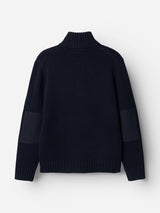 The BGfraser Zip Knit by Blue de Gênes in Dark Navy is a long-sleeve wool sweater featuring a ribbed turtleneck, cuffs, and hem, shown from the back. This roll neck style includes dark elbow patches on both sleeves.