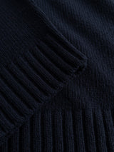 Close-up of the dark navy ribbed knit fabric from the Blue de Gênes BGfraser Zip Knit sweater, highlighting the detailed texture and pattern of the material.