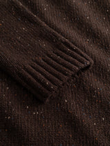 Close-up of the BGadamo Crewneck Knit in Hot Fudge Brown by Blue de Gênes, featuring a brown wool knit sleeve with ribbed cuffs and small multicoloured nep flecks woven throughout the fabric.