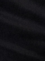 Close-up of navy denim fabric showing diagonal twill weave pattern and subtle variations in texture and shading, highlighting the comfort stretch twill used in Blue de Gênes’ BGvinci Iro Pant.