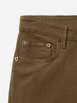 Close-up of Blue de Gênes BGvinci Iro Pant in Beech Green, featuring a front pocket, small coin pocket with metal rivets, belt loops, and a small embroidered shield emblem on the coin pocket. Crafted from comfort stretch twill, these regular fit pants showcase a distinctive diagonal twill pattern.