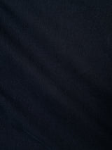 Close-up of BGmenzo Vecchio Chino - Dark Navy by Blue de Gênes: dark, textured fabric with subtle diagonal lines and shadows, creating a soft, slightly ribbed look—ideal for men's chinos with vintage appeal.