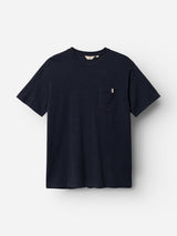 The BGoscar T-Shirt - Dark Navy by Blue de Gênes is a plain, short-sleeve 100% cotton crewneck with a small left chest pocket, shown on a white background.