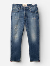 The BGvinci Break Jeans - Denim wash by Blue de Gênes are regular fit, dark blue jeans with distressed detailing, visible fading and rips, crafted from comfort stretch denim. Designed with five pockets and a button fly, they are displayed laid flat on a white background.