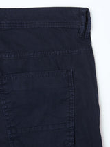 Close-up of the back pocket and waistband of the BGpaulo Teo Pant - Dark Navy by Blue de Gênes, highlighting detailed stitching and fabric texture inspired by vintage military pants, set against a white background.