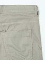 Close-up of the upper section of the BGpaulo Teo Pant in Shadow Green by Blue de Gênes, highlighting the waistband, belt loop, and a single back pocket on a white background.