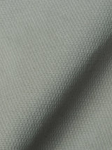 Close-up of shadow green fabric from the BGpontus Teo Overshirt by Blue de Gênes, featuring a subtle, small checkered pattern and a visible fold running diagonally across the image—showcasing the refined detailing characteristic of this relaxed fit overshirt.