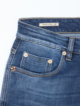 Close-up of Blue de Gênes Recco Blue Vintage Jeans - Vintage Wash showing the front pocket, belt loop, contrast stitching, copper rivets, and an Italian-flag Made in Italy label sewn inside the waistband.