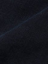 Close-up of Blue de Gênes Recco BlueBlk Jeans in blue-black denim, highlighting the detailed woven texture and fine stitching along a diagonal seam.