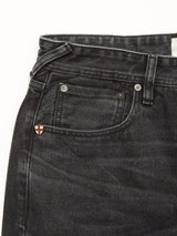Close-up of the upper section of Blue de Gênes Giacomo BLK Used Jeans in grey denim, highlighting the waistband, belt loop, front pocket, and a small shield-shaped logo on the coin pocket.