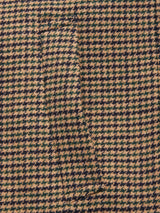 Close-up of the Massone Check Coat - Multi Check by Blue de Gênes, featuring a brown, tan, and dark green houndstooth pattern with a subtle pocket blending into the Italian wool Melton weave.