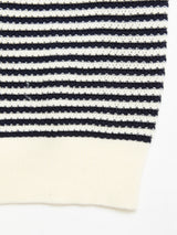 Close-up of the BGbob Knit Polo by Blue de Gênes, crafted in 100% cotton with navy and white horizontal stripes and finished with a solid off-white ribbed hem.