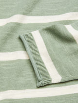 A close-up of the Monte Stripe Knit - Green Bay by Blue de Gênes highlights its light green fabric with horizontal white stripes, showing the sleeve and part of the sweater’s body.