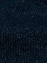Close-up of Blue de Gênes Vinci Topaz Jeans in Rinse Wash, showcasing the comfort stretch denim’s woven texture, fine threads, and subtle color variations with lighter blue flecks throughout.