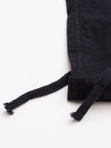 Close-up of the bottom hem and braided drawstrings of the Blue de Gênes Mustang Cargo Pant in navy, shown against a white background.