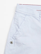 Close-up of Blue de Gênes Menzino Shorts - Blue Water, featuring a side pocket, belt loop, and a small crisscross-design button near the pocket opening.