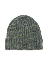 The Oscar Melange Beanie - Forest by Blue de Gênes is a green ribbed knit hat with multicolored speckles, a folded cuff, and a small dark patch featuring a shield emblem on the edge.