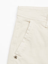 A close-up of Blue de Gênes Menzo Dobby Chino - Stone highlights the waistband, belt loop, side pocket, and a small metal emblem near the pocket.