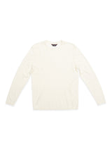 The Blue de Gênes Monte Knit - Whitecap, a plain long-sleeve off-white crewneck shirt, is laid flat on a white background.