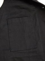 Close-up of the inner pocket of the Blue de Gênes Canna Carbonio Gillet in black, highlighting the neat stitching and textured fabric.